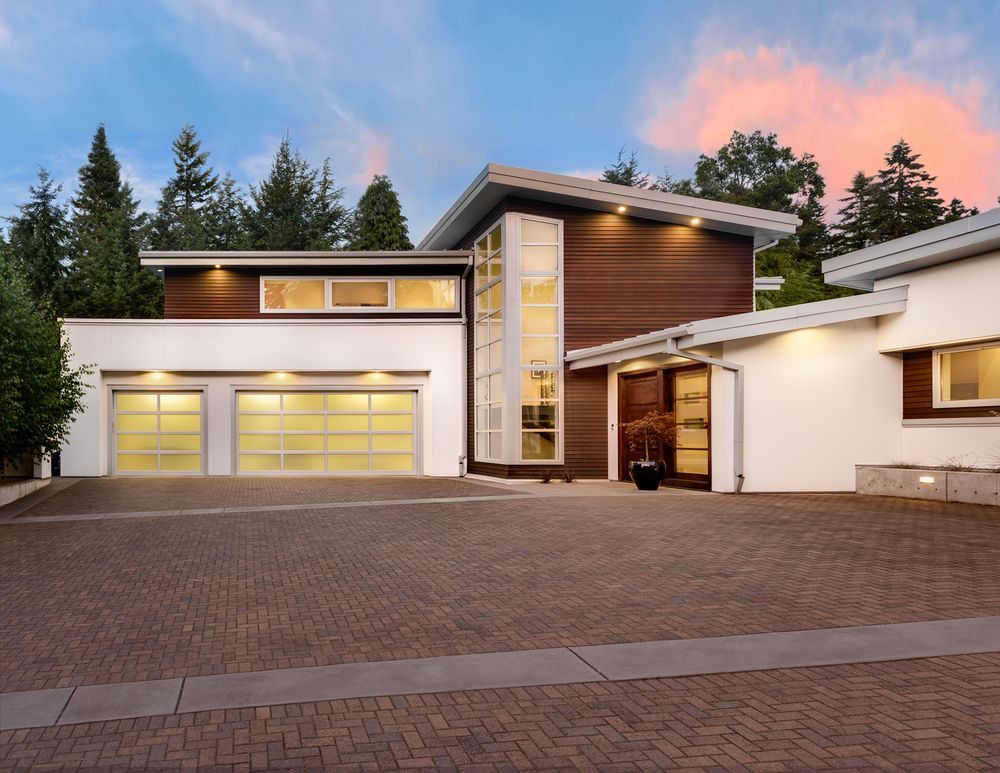 Modern Two Story House with A Large Garage and Brick Driveway at Sunset — WJG Built in Byron Bay, NSW