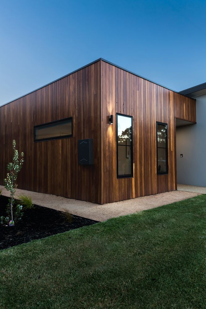 Modern Wood Clad House Exterior with Narrow Windows and A Small Lawn at Dusk — WJG Built in Yamba, NSW