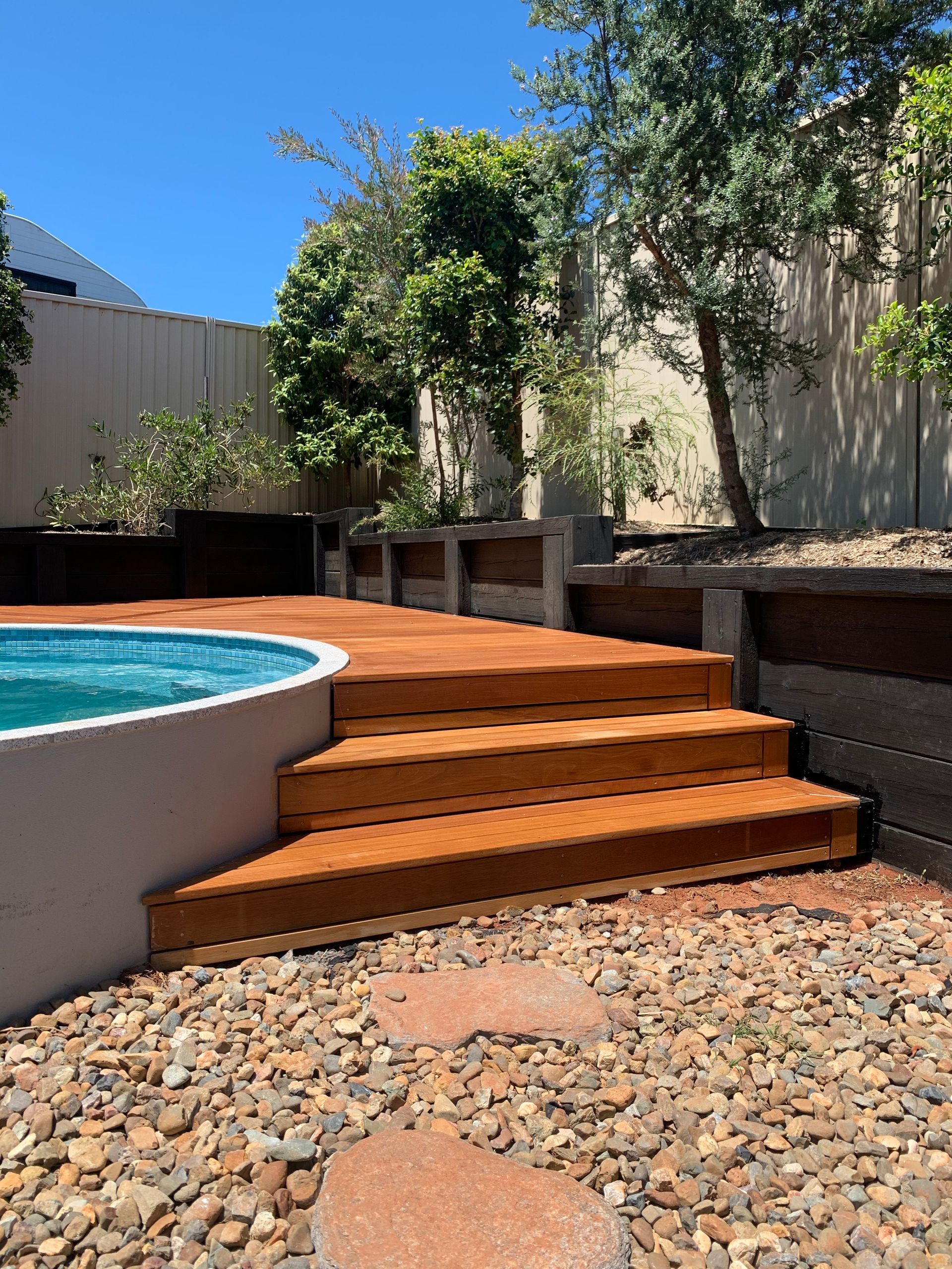 Backyard Pool with Wooden Steps and Raised Garden Beds — WJG Built in Wollongbar, NSW