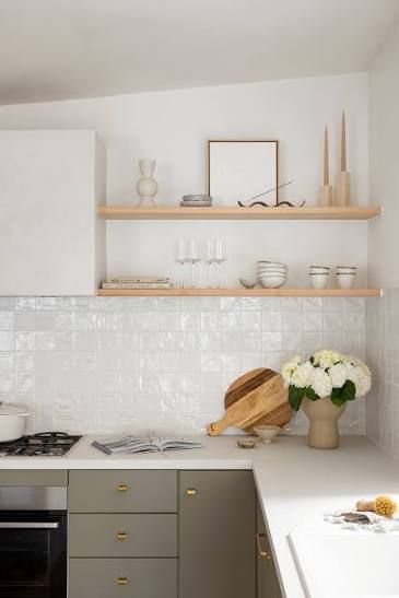 Bright minimalist kitchen with white tile backsplash, open shelves, gray cabinets, and flowers on the counter — WJG Built in Wollongbar, NSW