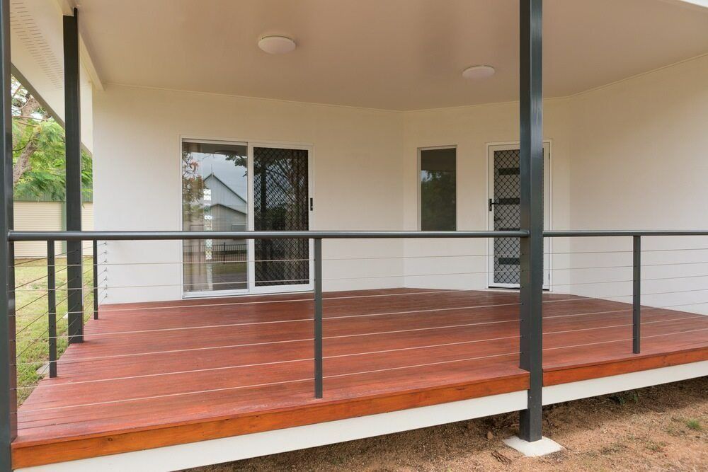 Covered Porch with Red Deck Boards and Black Railings — WJG Built in Wollongbar, NSW