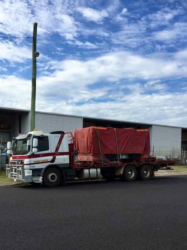 A Truck With a Red Cover on It — Reliable Machinery Transport in Mareeba, QLD