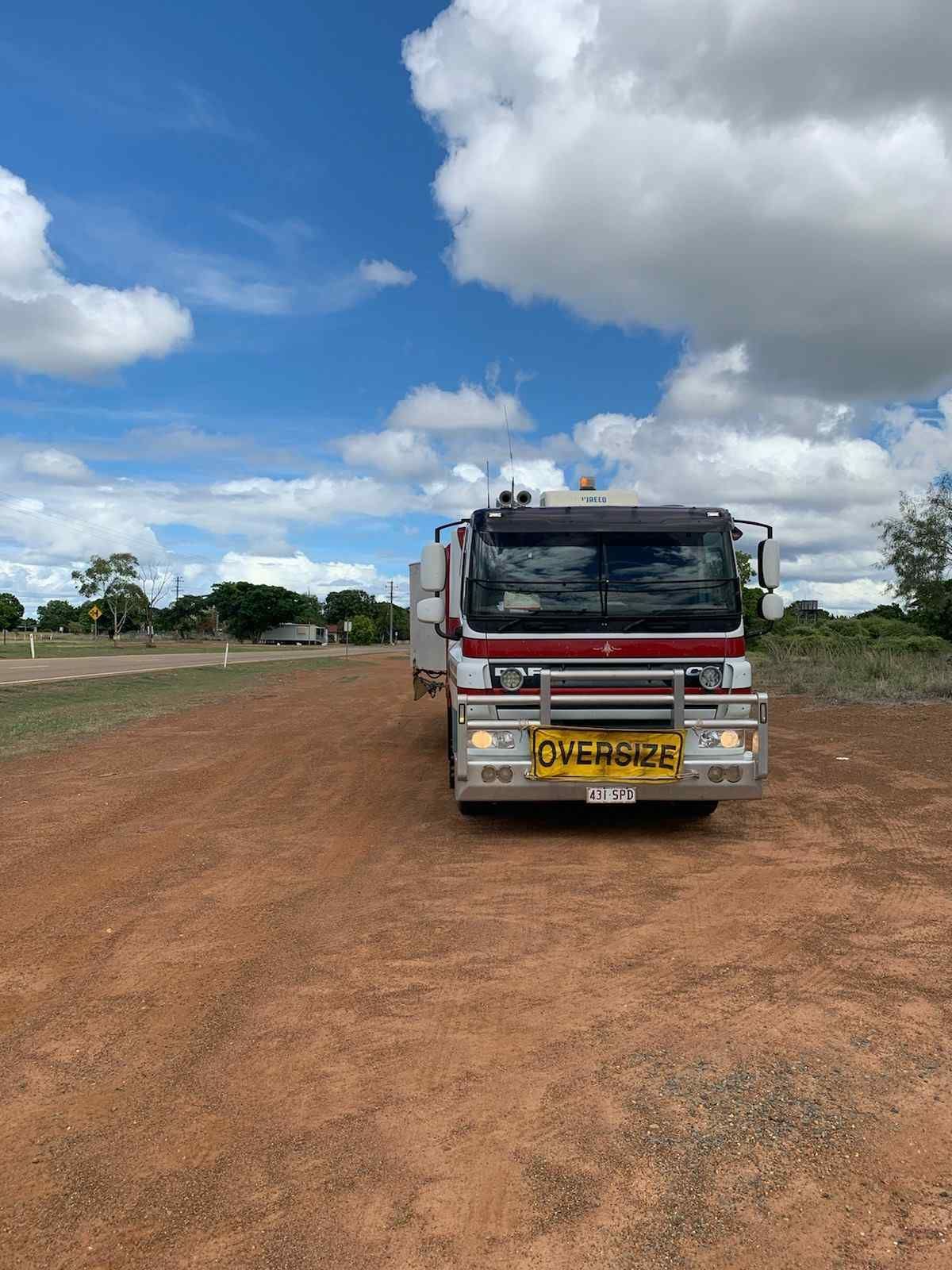 A Truck on a Dirt Road — Container, Machinery & General Freight Transport in Mount Isa, QLD