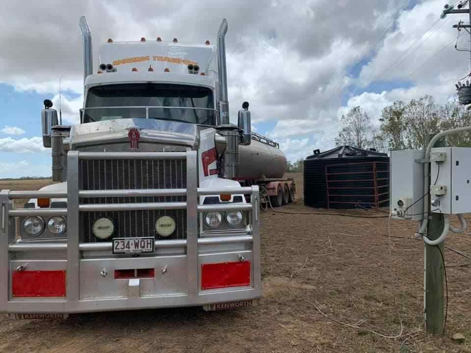 A Truck Parked on a Dirt Field — Container, Machinery & General Freight Transport in Mount Isa, QLD