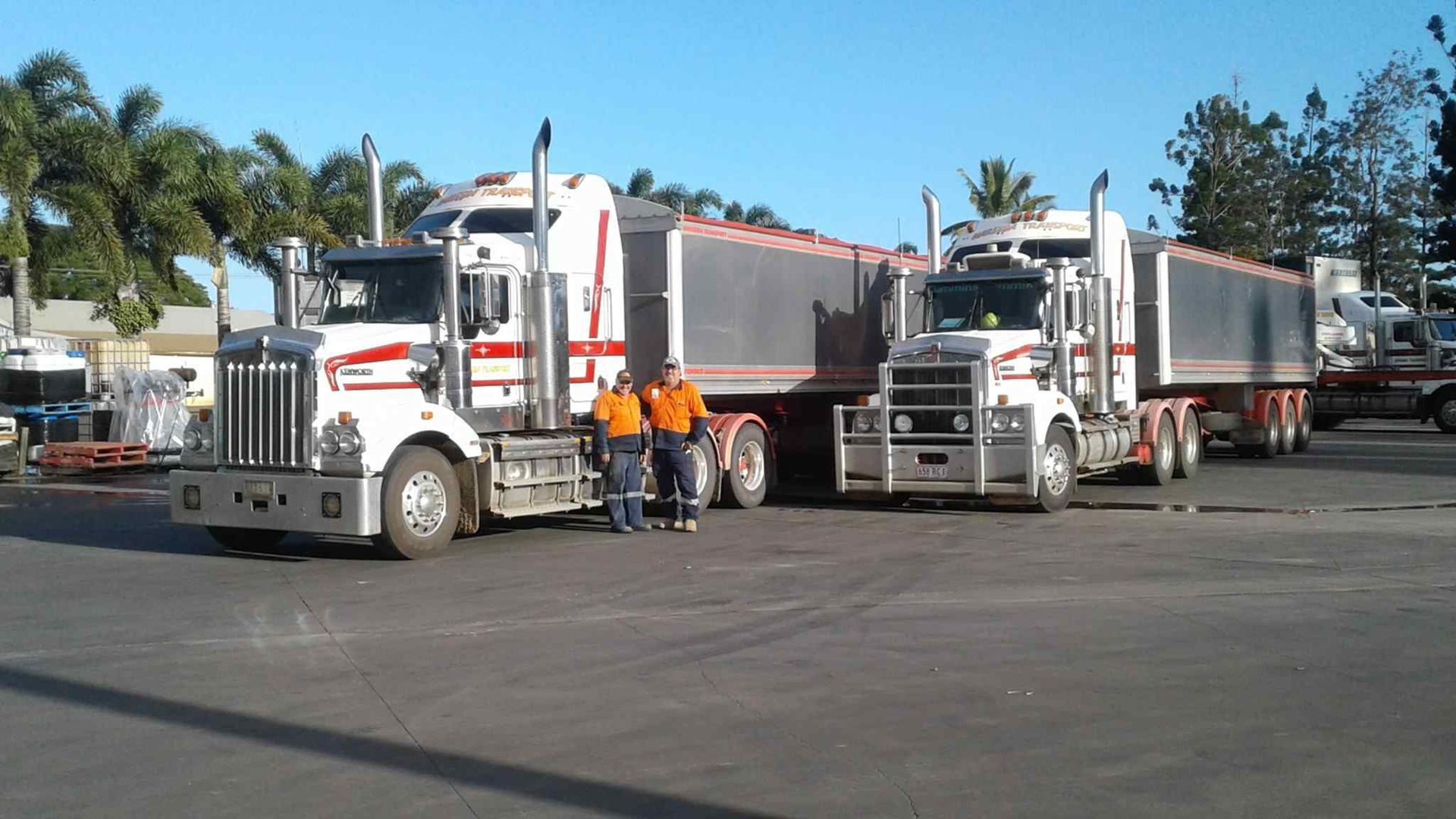 A Group of Men Standing Next to a Semi Truck — Reliable Machinery Transport in Mareeba, QLD