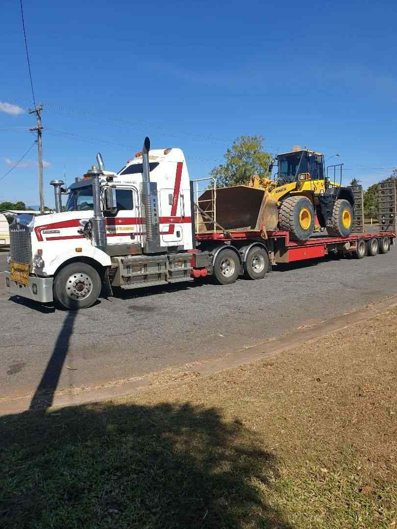 A Tractor on a Trailer — Reliable Machinery Transport in Mareeba, QLD