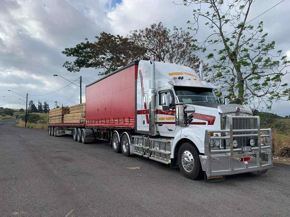 A Truck With a Trailer on the Side — Reliable Machinery Transport in Mareeba, QLD