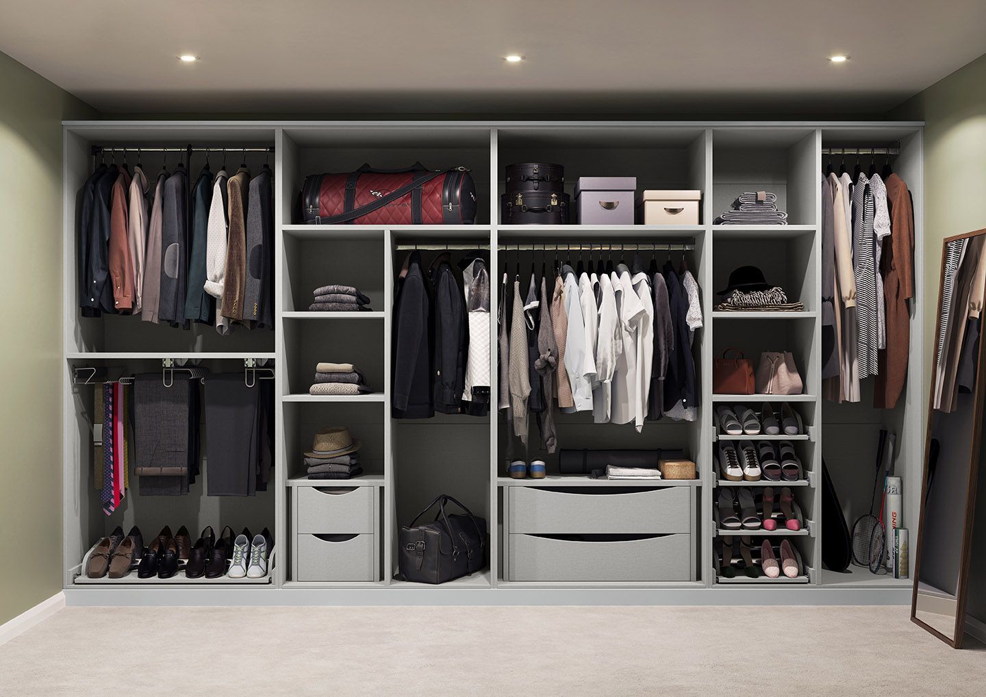 A large walk in closet filled with lots of clothes and shoes.