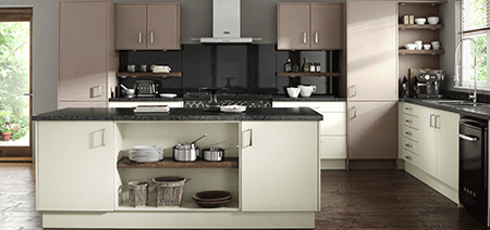 A kitchen with white cabinets and a black counter top
