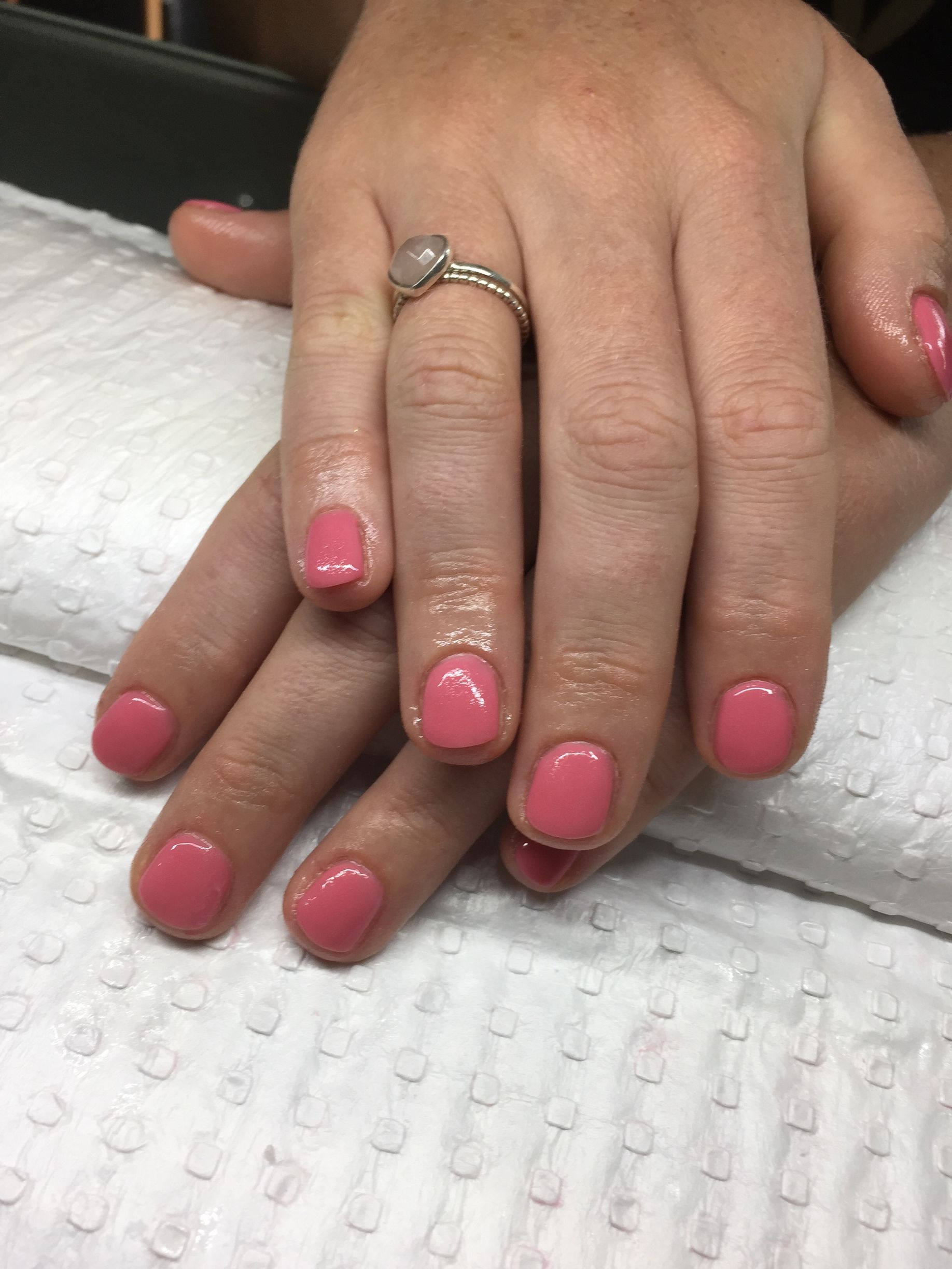 A woman's hands with pink nails and with a ring — Nailz By Dezign In Proserpine, QLD