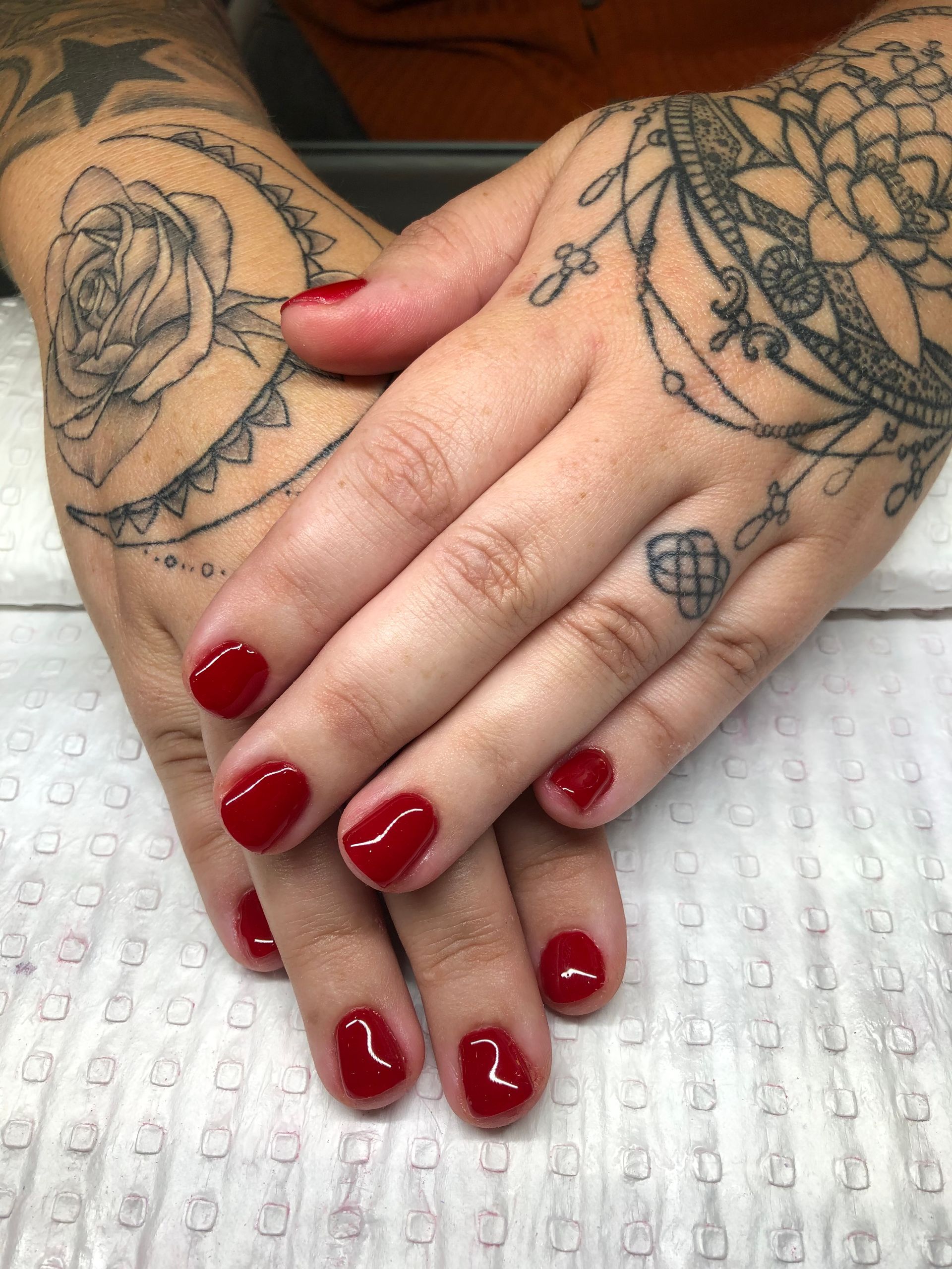A close up of a woman's hands with red nails — Nailz By Dezign In Proserpine, QLD