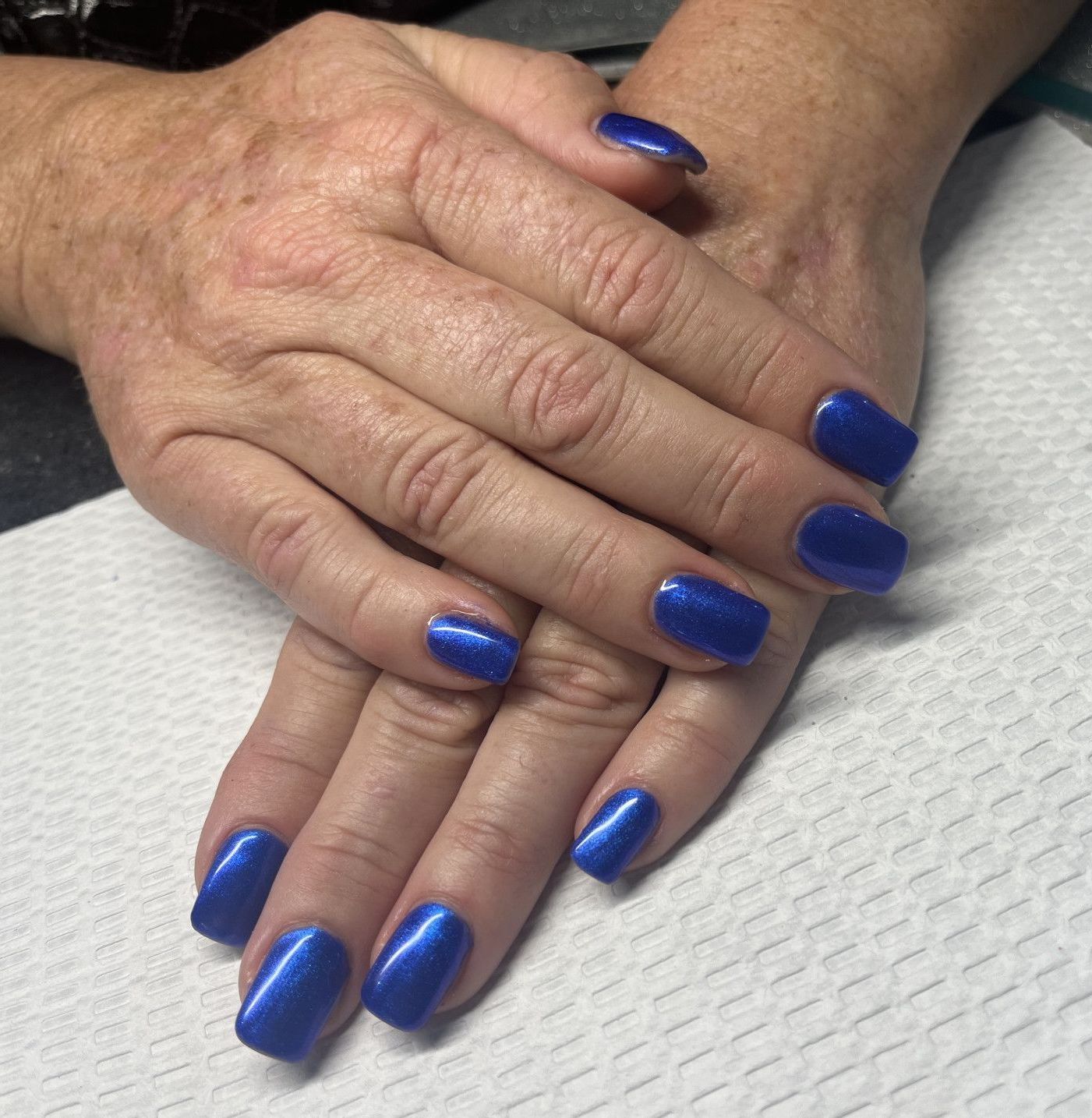 A close up of a woman's hands with blue nails — Nailz By Dezign In Proserpine, QLD