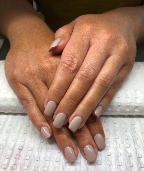 A Close Up of a Woman's Hands With Beige Nails — Nailz By Dezign In Airlie Beach, QLD