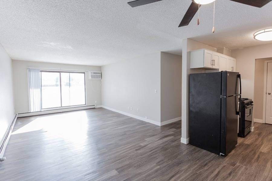 Kitchen and living room space in apartment.