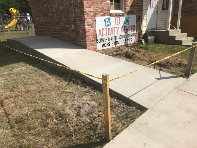 A brick building with a sign that says abc activity center
