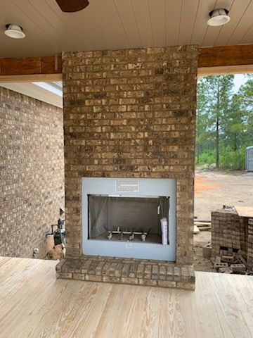 There is a fireplace in the middle of the room.