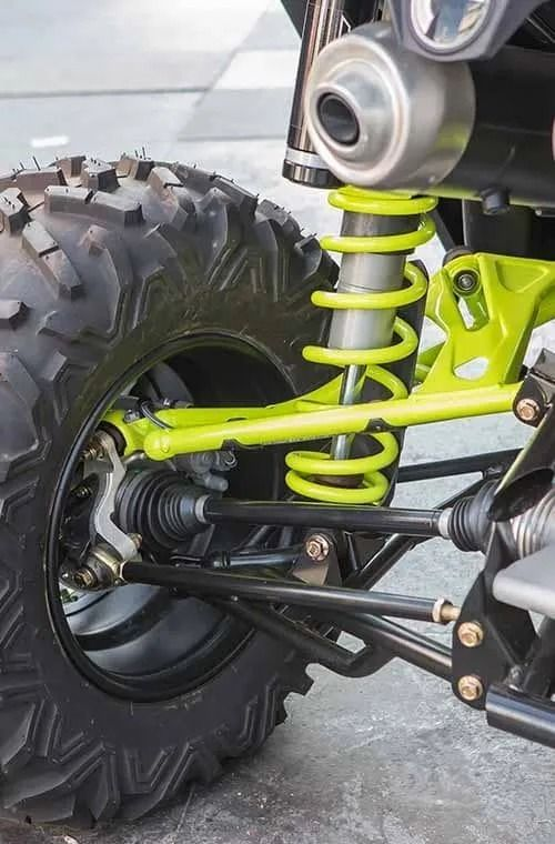 A close up of a suspension system on a atv.