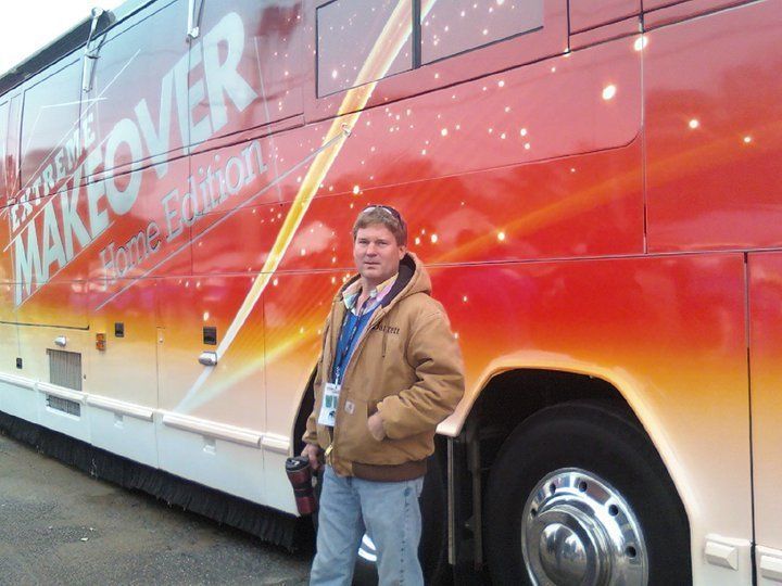 Door Repairs Georgia — Man Standing Beside Home Makeover Truck in Augusta, GA