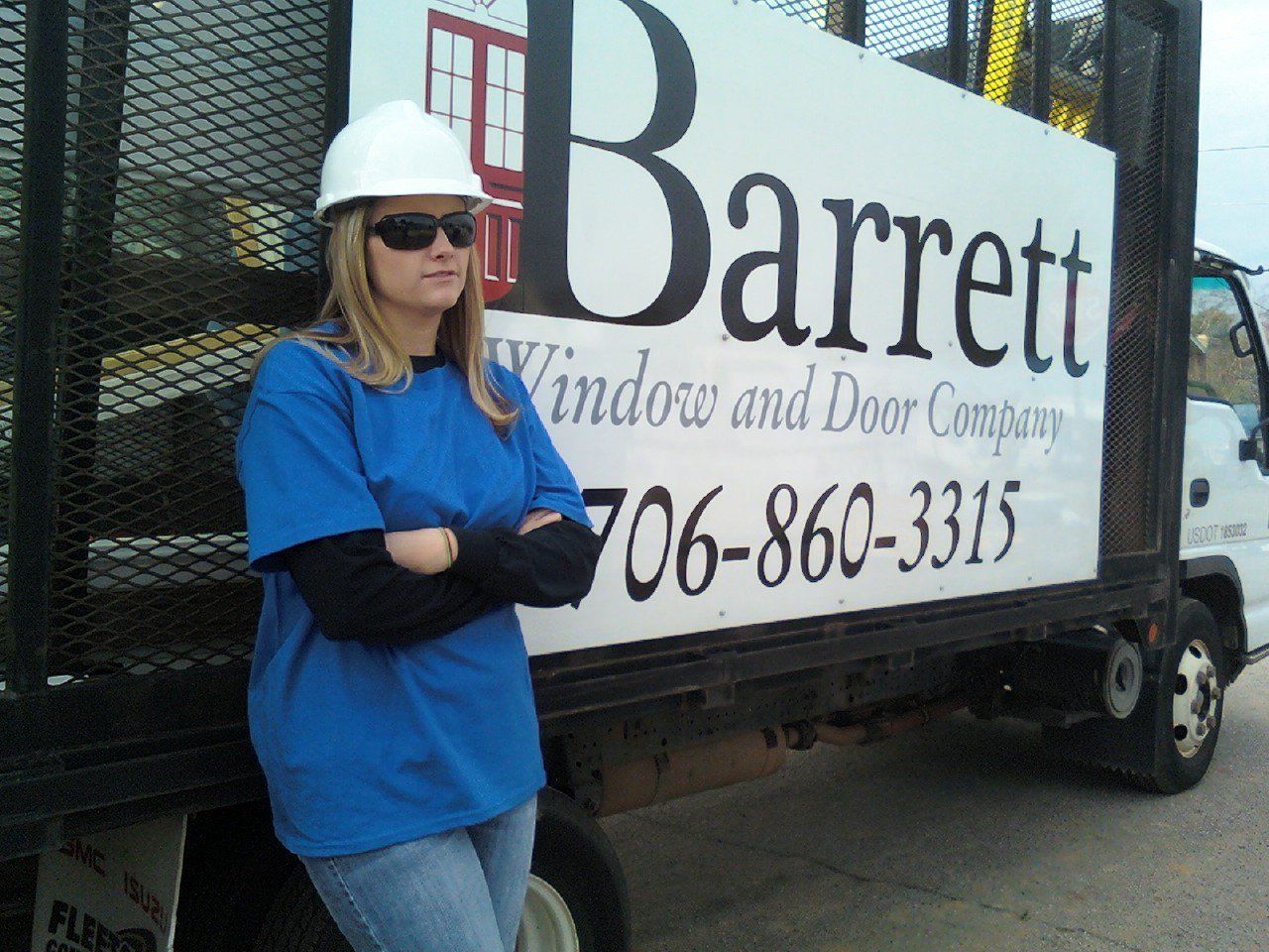 Window Installations Georgia — Woman Leaning at Barret Signage in Augusta, GA