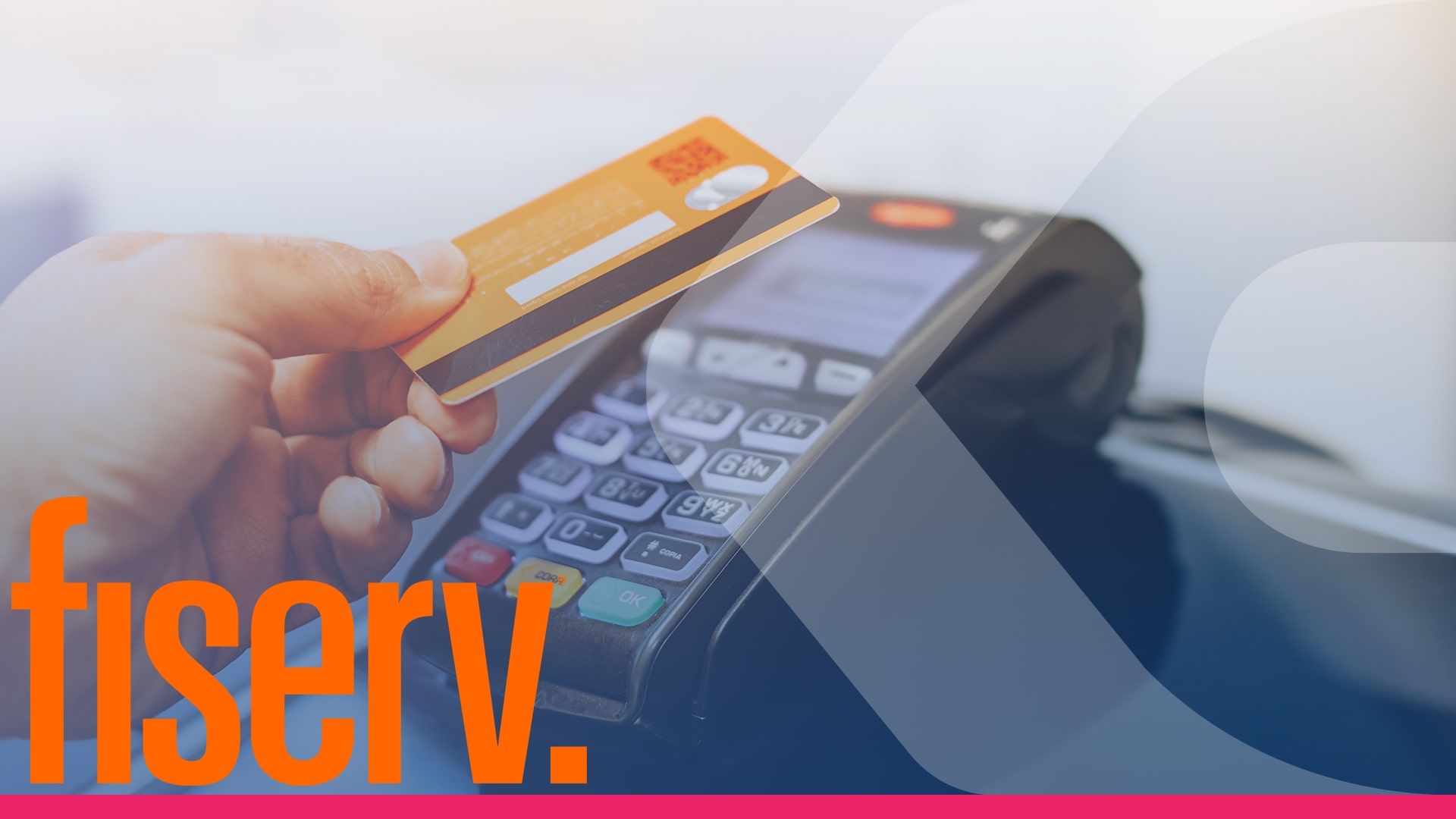 A person is holding a credit card in front of a credit card machine.