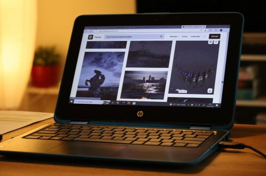 A blue hp laptop is open to a website