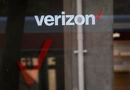 A close up of a verizon logo on a glass window.