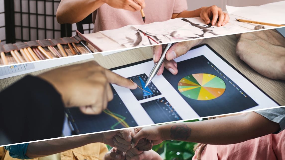 A group of people are sitting at a table working on a project.