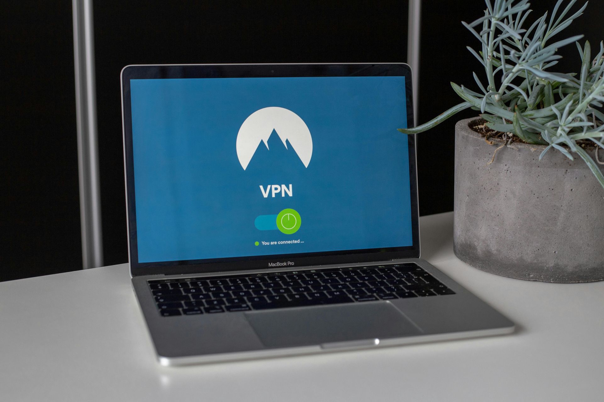 A laptop is open to a screen that says vpn on it