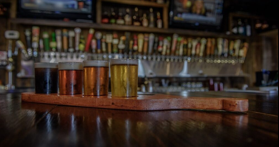 Two drinks are sitting on a wooden table.