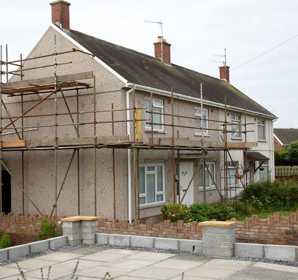 a house with a lot of scaffolding around it.