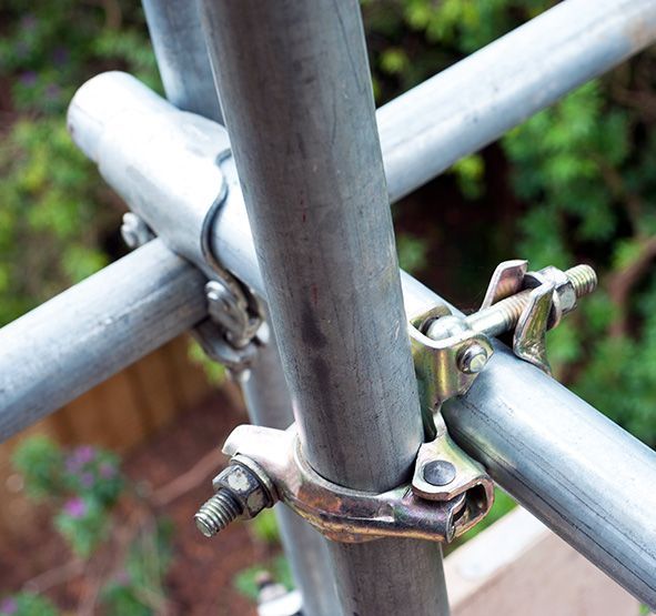 A close up of a metal pole with a clamp attached to it