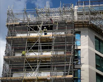 A building under construction with scaffolding around it