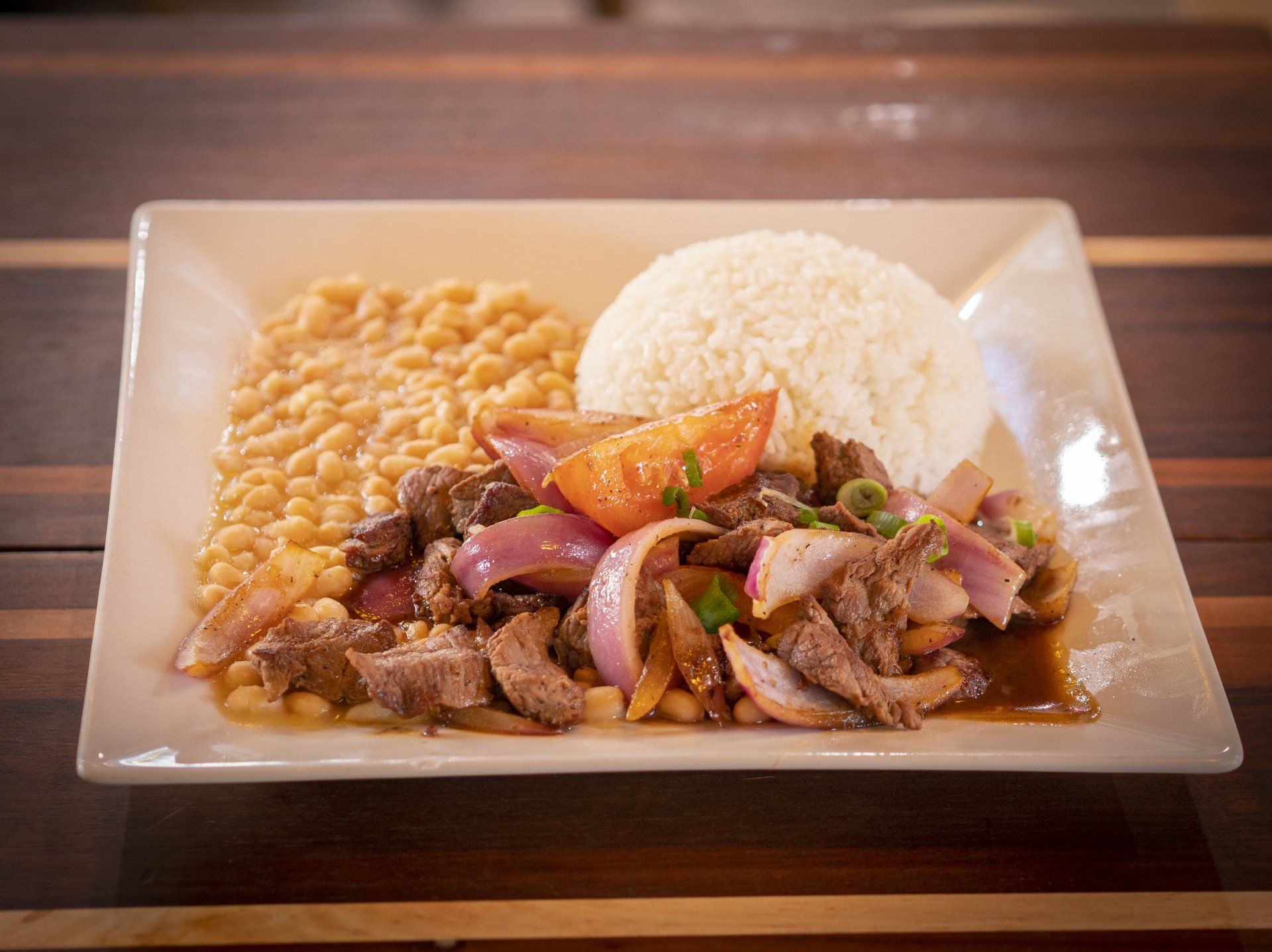 Beef dish with rice and beans.