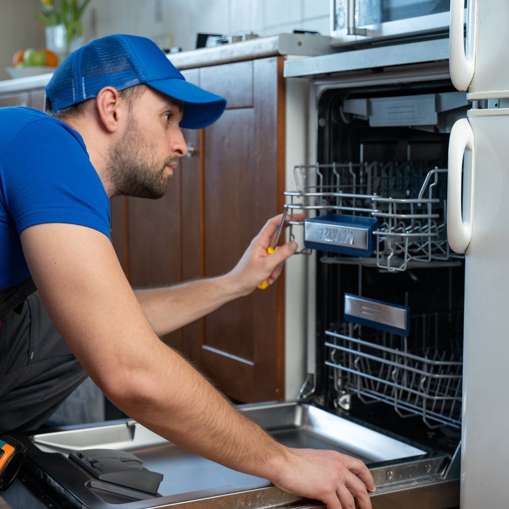 Man Repairing Dishwasher — Geelong West, VIC — Graeme Kent Electrical Appliance Pty Ltd