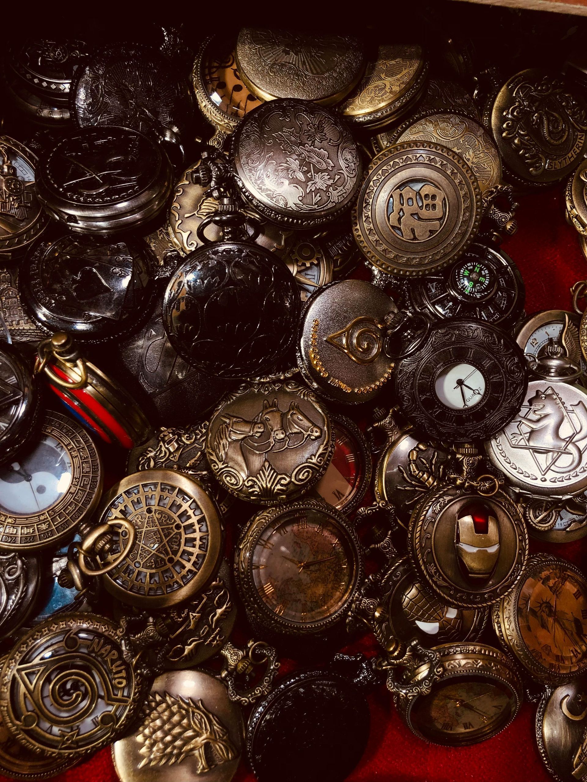 Display of various fedora hats on pedestals, in a shop.