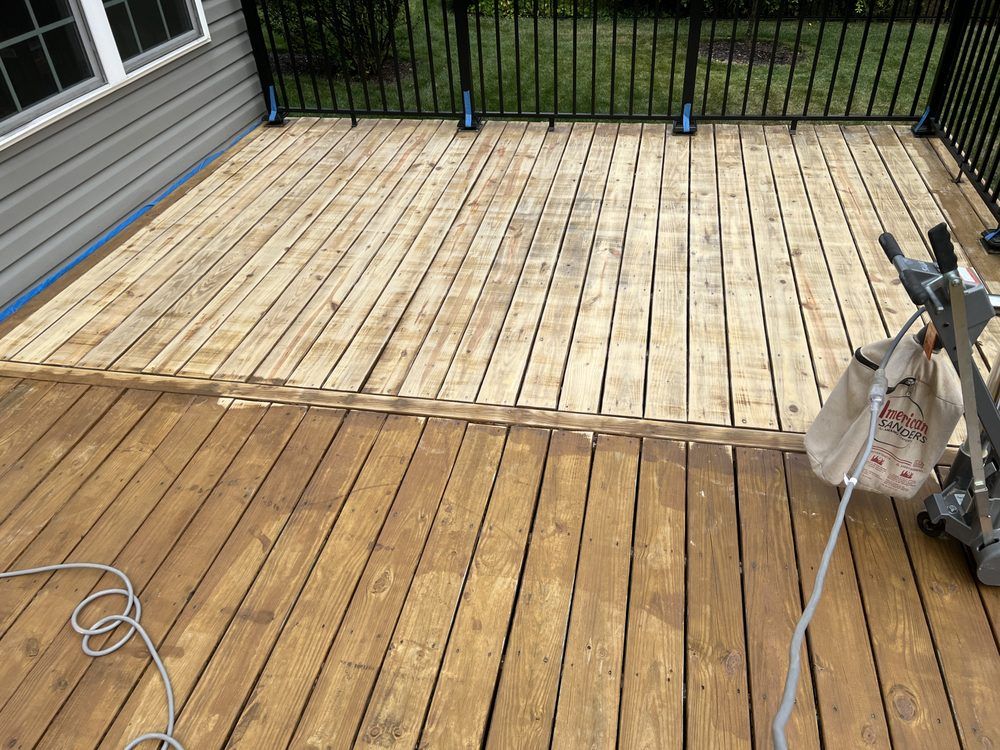 A wooden deck with a vacuum cleaner on it.