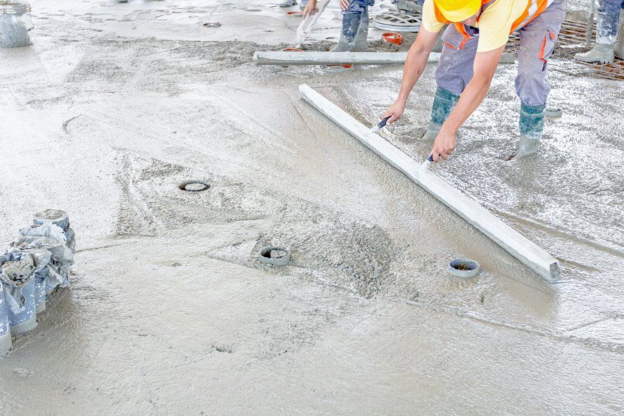 worker flattens the cement