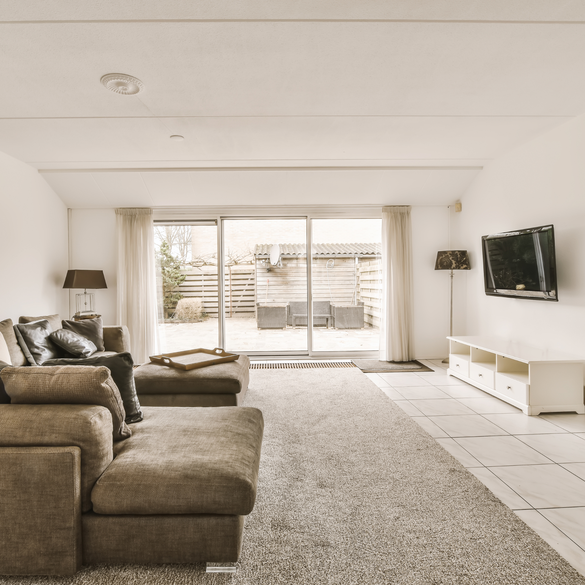 A living room filled with furniture and a flat screen tv