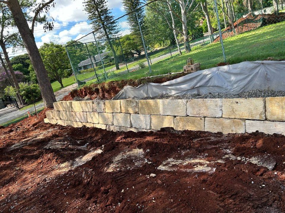 A Small Waterfall is Coming Out of a Drain Under a Bridge — CWD Group in Springwood, QLD