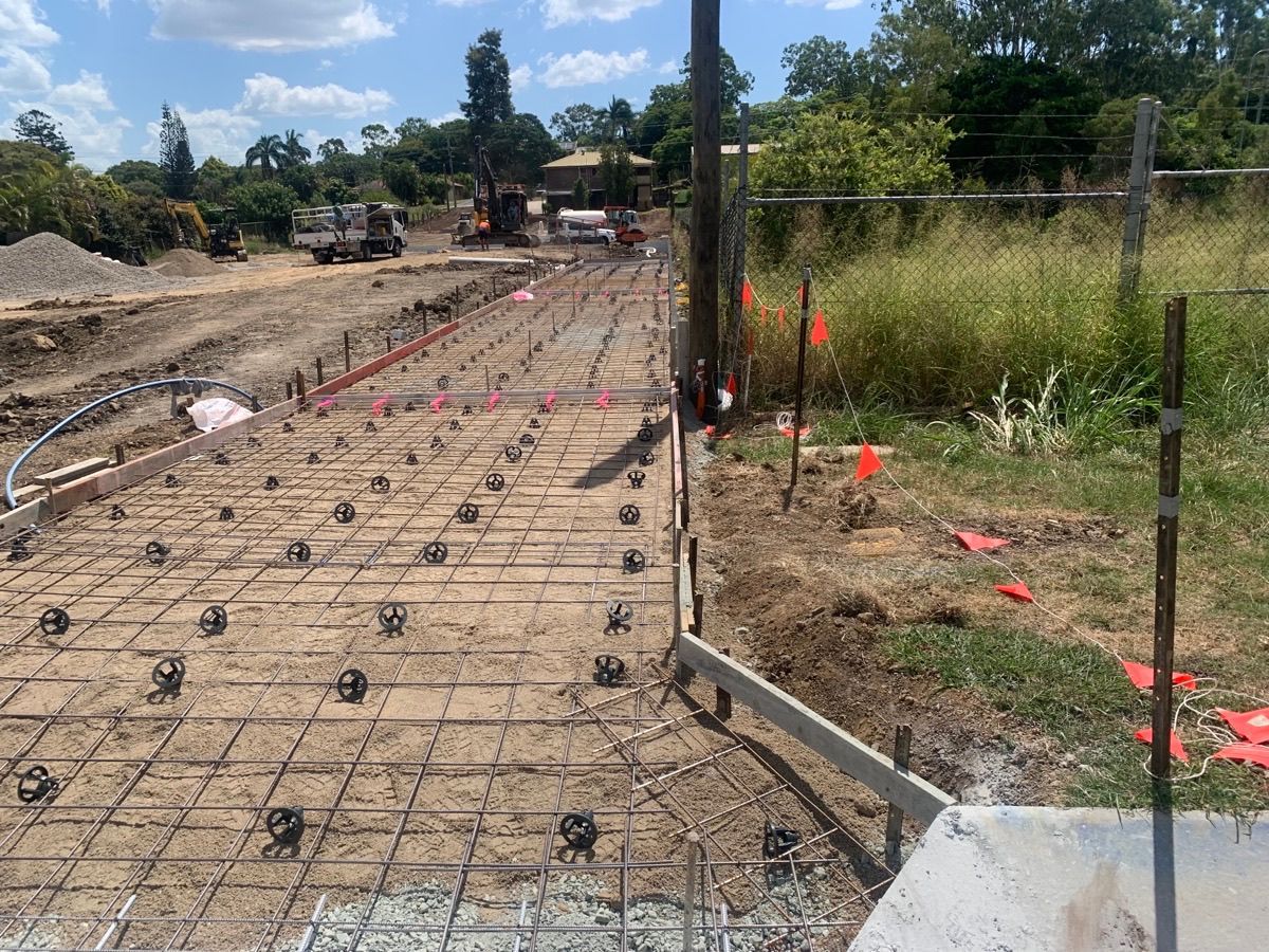 Two construction workers are working on a construction site — CWD Group in Springwood, QLD