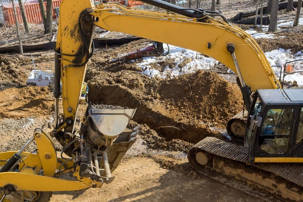 A Excavator is Digging a Hole in the Ground — CWD Group in Springwood, QLD