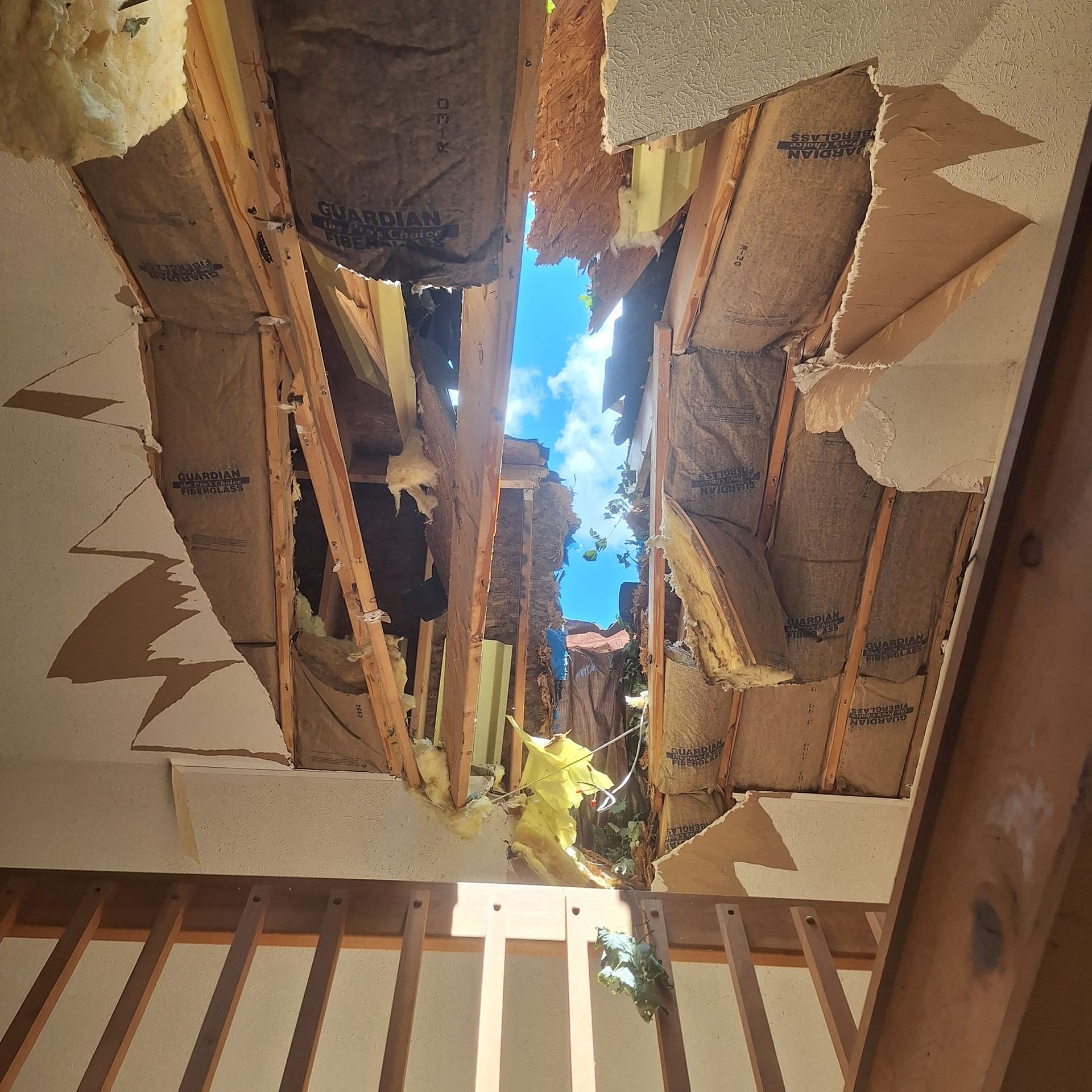 Looking up at the sky through the ceiling of a building