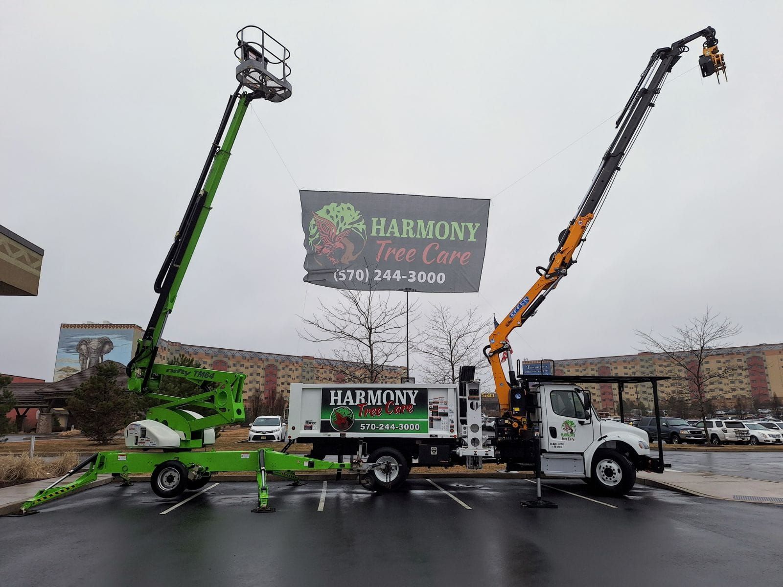 Two trucks are parked next to each other in a parking lot.