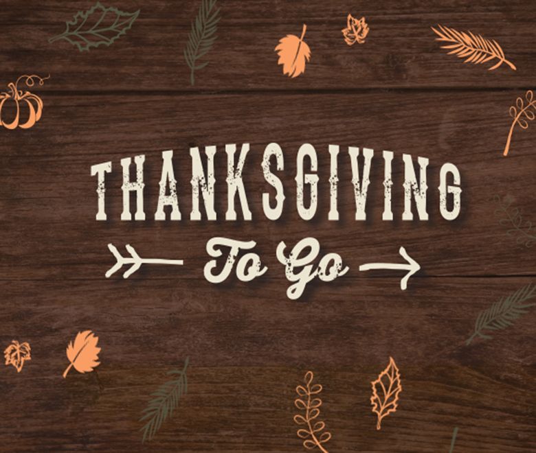 A wooden sign that says thanksgiving to go