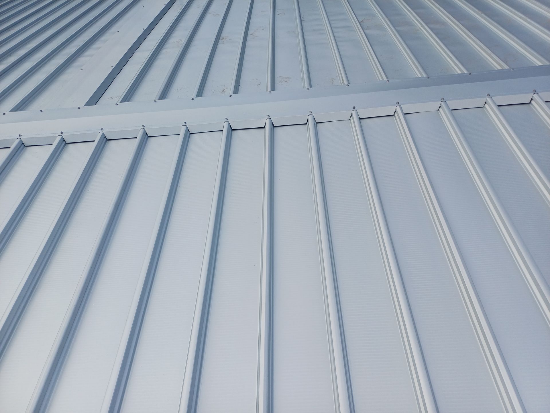 A Close Up Of A Metal Roof On A Building — Rooftech Roofing Services in Lismore, NSW