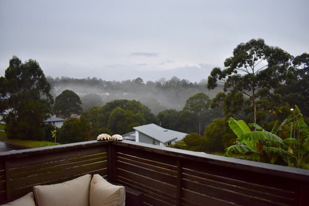 A Balcony with A View of Trees and Houses on A Cloudy Day — Rooftech Roofing Services in Goonellabah, NSW