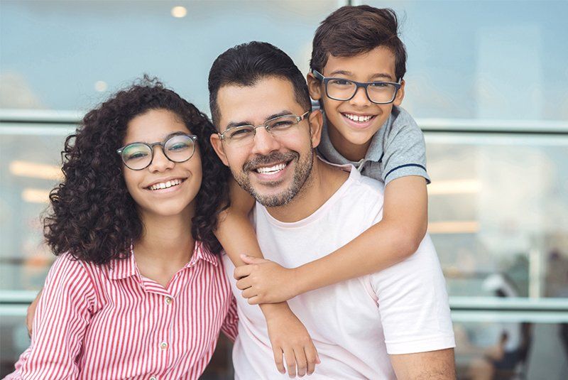 Dad, Son and Daughter – Cruz Davis Family & Cosmetic Dentistry