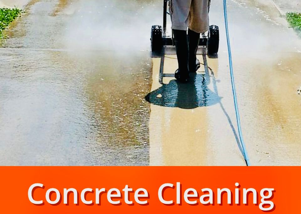 Man pressure washing a concrete driveway, revealing the cleaned surface.