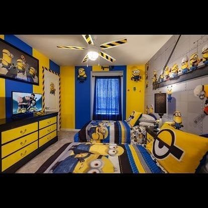 Minion-themed bedroom with blue and yellow walls, twin beds, and Minion decorations.