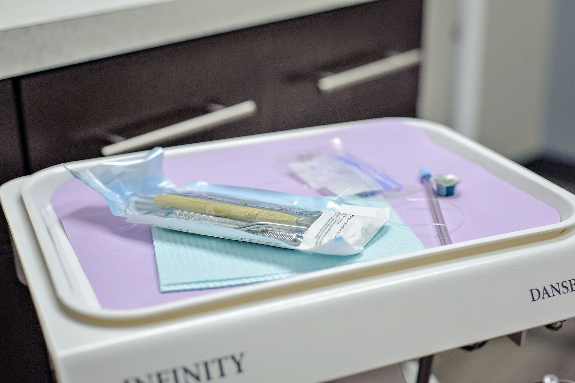 A tray with dental instruments on it in a dental office.